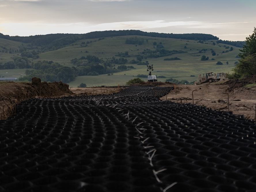 Geocell panels laid over a large earthworks area