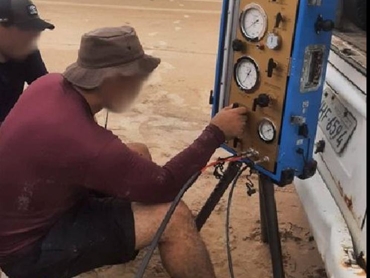 Operators reading the pressuremeter control unit on site
